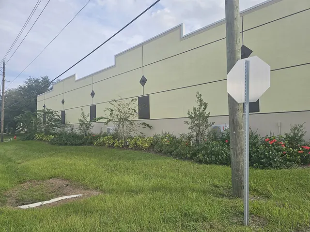 Landscaped exterior wall of the Punta Gorda garage condo building