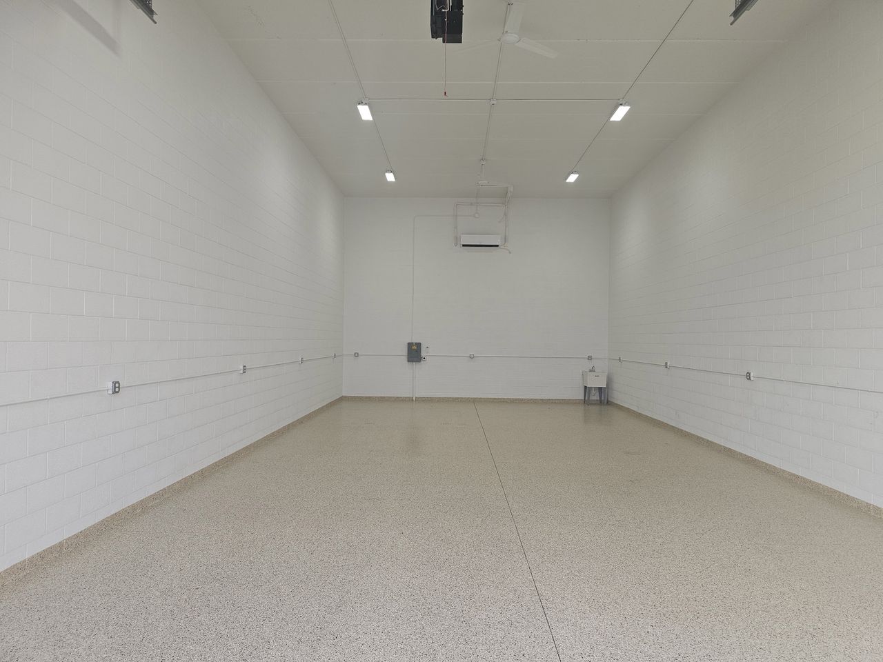 Full-depth view of a finished garage condo interior