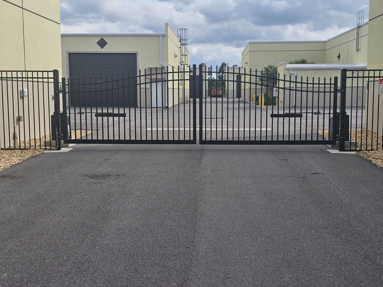 Gated entry and wide paved drive at the Punta Gorda boat storage garage condos